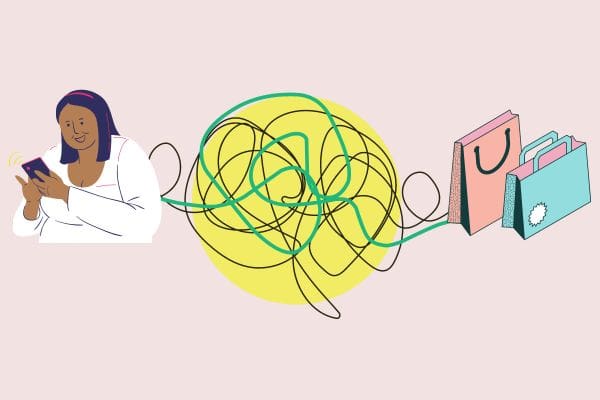 Woman holding phone with shopping bags